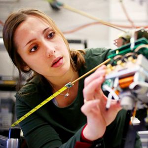 student working on a cubesat