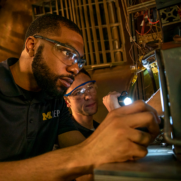 Students working inside the Large Vacuum Test Facility inside the Plasmadynamics and Electric Propulsion Laboratory (PEPL) on North Campus in Ann Arbor, MI. on October 18, 2019.