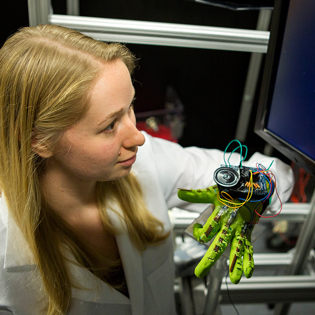Design Science woman testing a robotic hand
