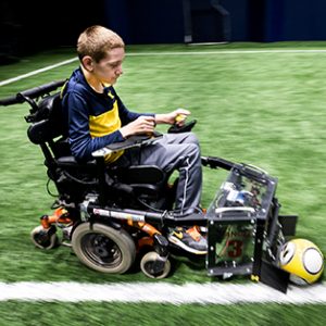 Mechanical engineering project to help a child with a soccer apperatis for his wheelchair