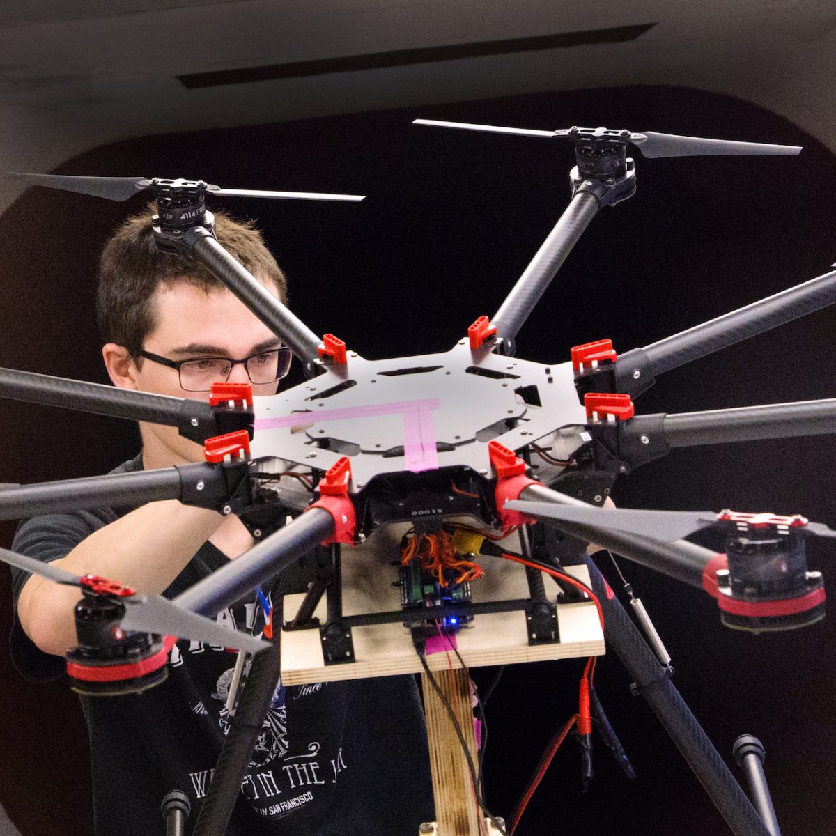 man working on octdrone